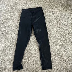 Black Foil Lululemon Wunder Under leggings size 4, 25 inch inseam.